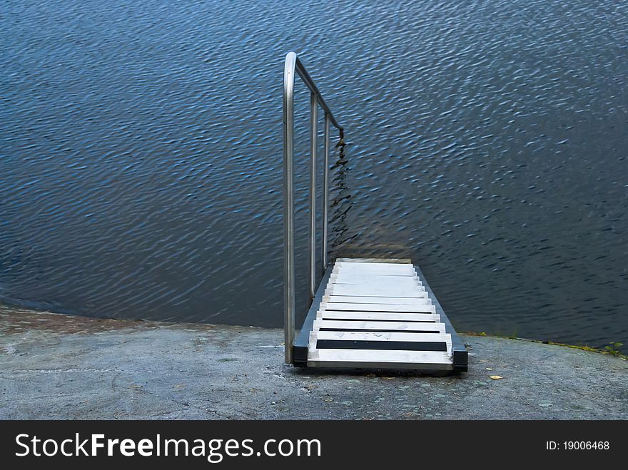 Steps and railing straight into the water. Steps and railing straight into the water