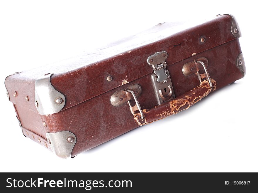 Old dusty brown leather suitcase