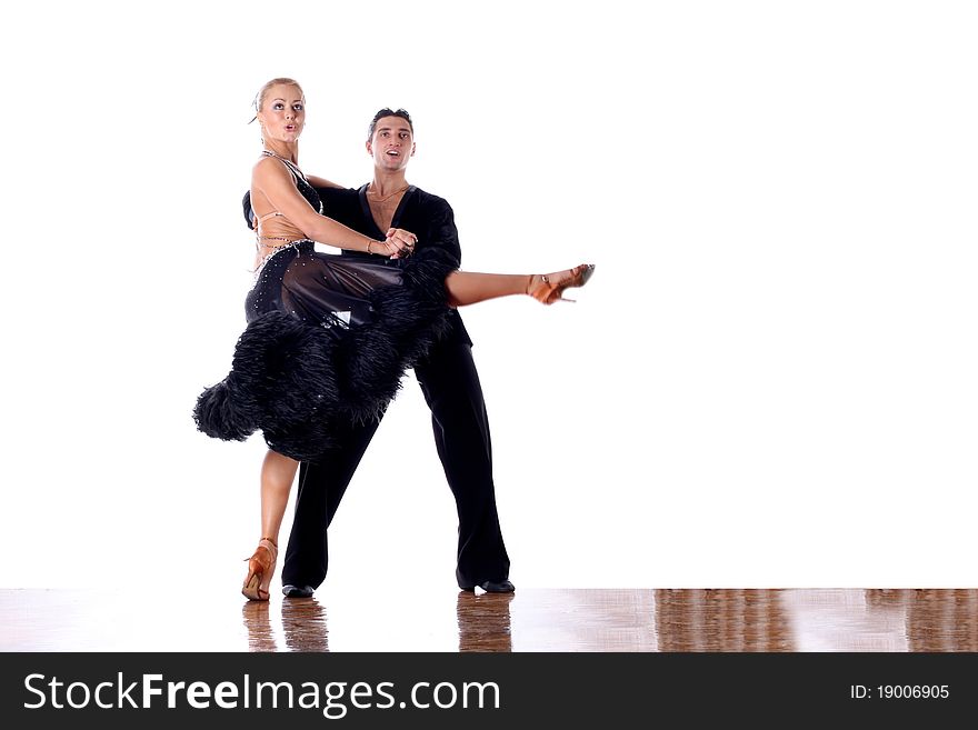 Dancers in ballroom against white background