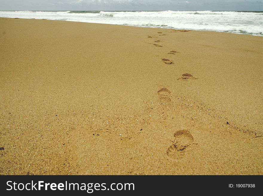 Footsteps at beach on a stormy day. Footsteps at beach on a stormy day