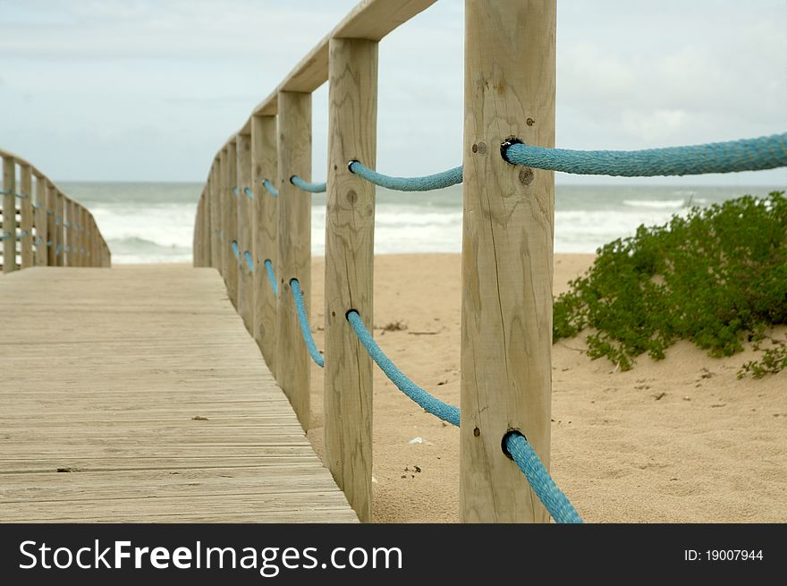 Wood access to empty beach in stormy day. Wood access to empty beach in stormy day