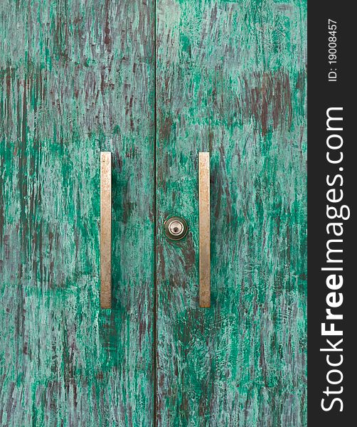 Wood green door with knob and keyhole