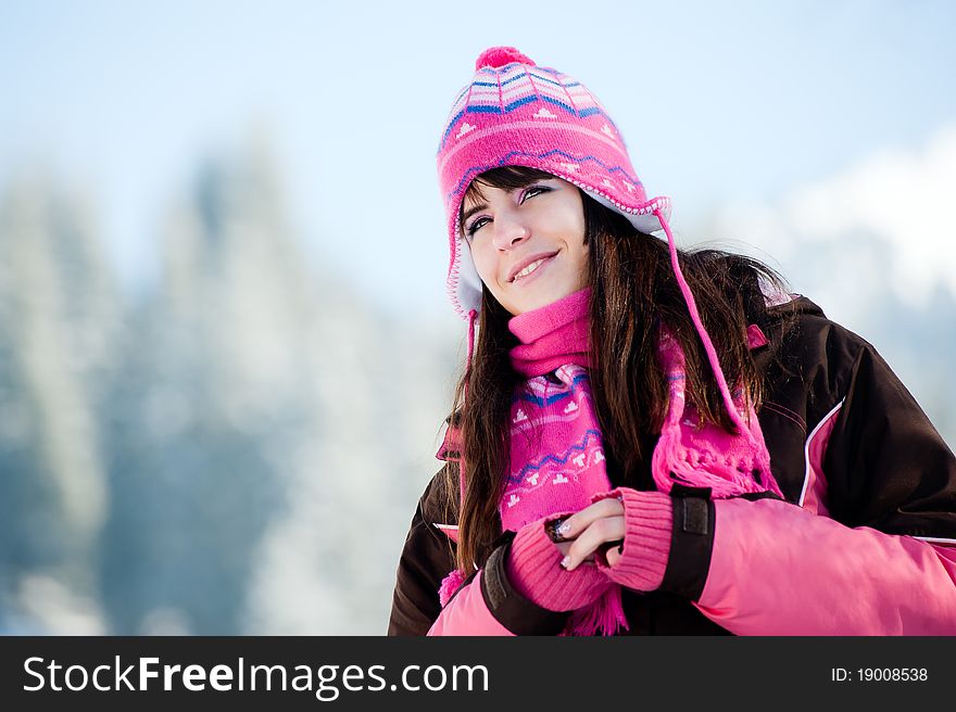 Attractive winter woman on sky and mountains background. Attractive winter woman on sky and mountains background