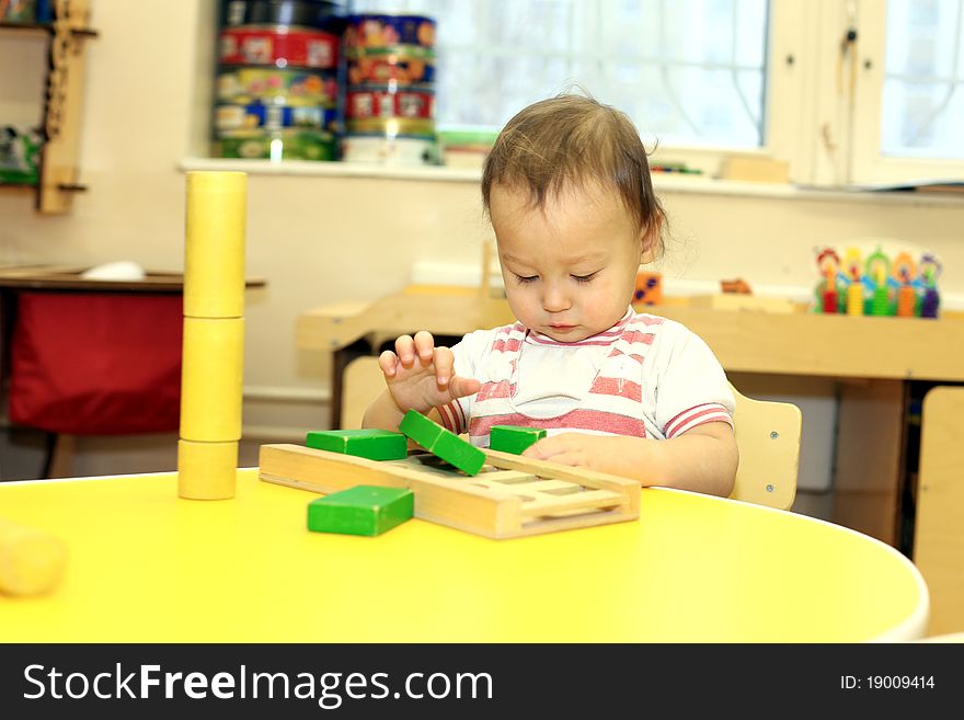 Baby playing with wooden blocks. Baby playing with wooden blocks