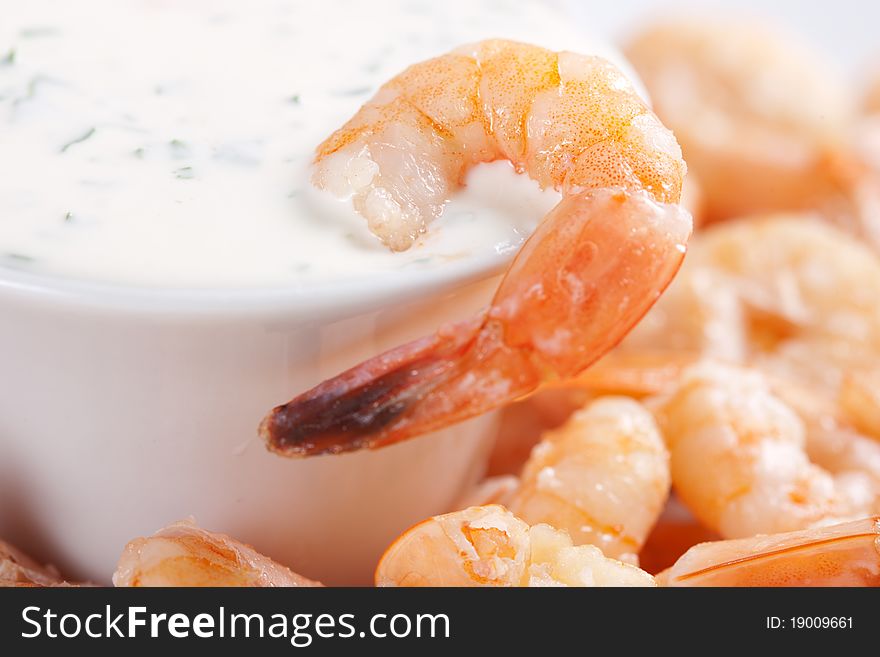 Fried shrimps on a plate and sauce