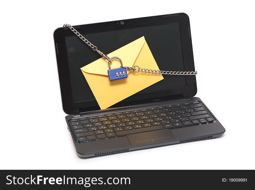 Yellow paper envelope attached to laptop with chains and padlock. Yellow paper envelope attached to laptop with chains and padlock