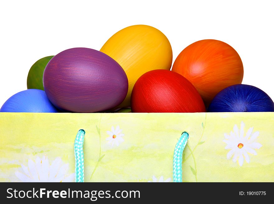 Colorful Easter eggs in gift bag, isolated on white