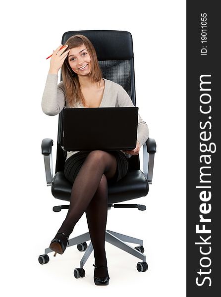 Young business lady in a chair with a laptop isolated on white background