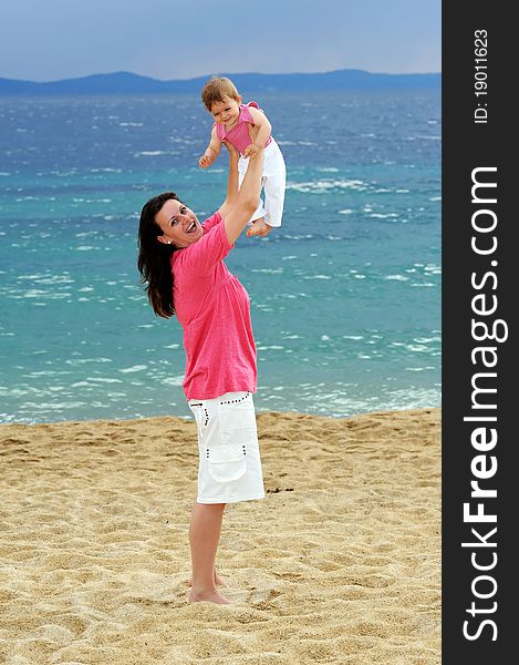 Mother with her adorable baby at beach. Mother with her adorable baby at beach