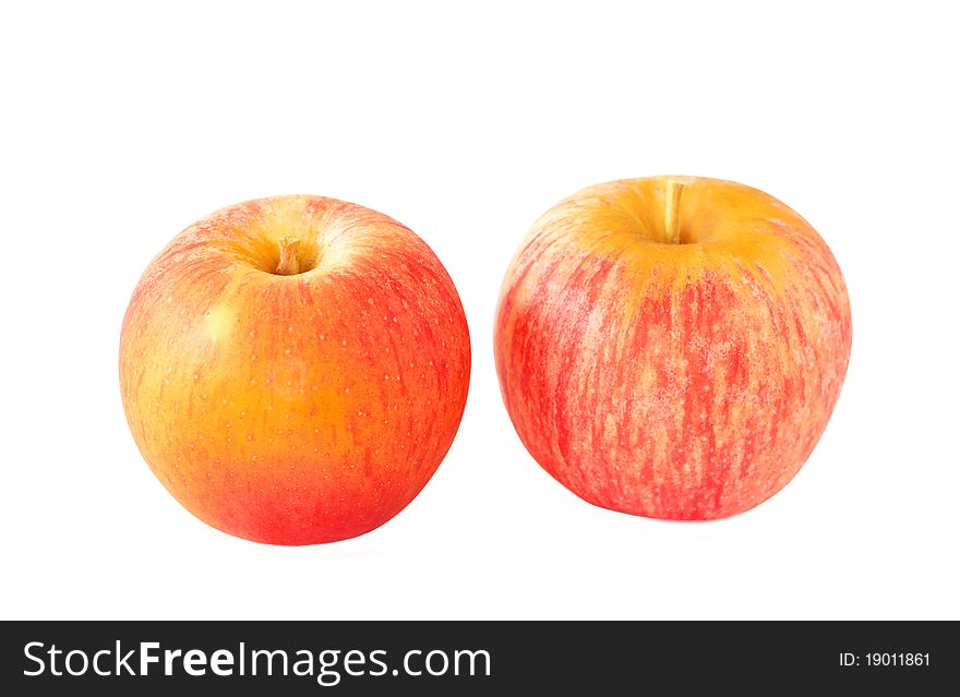 Two ripe organic apples on white background