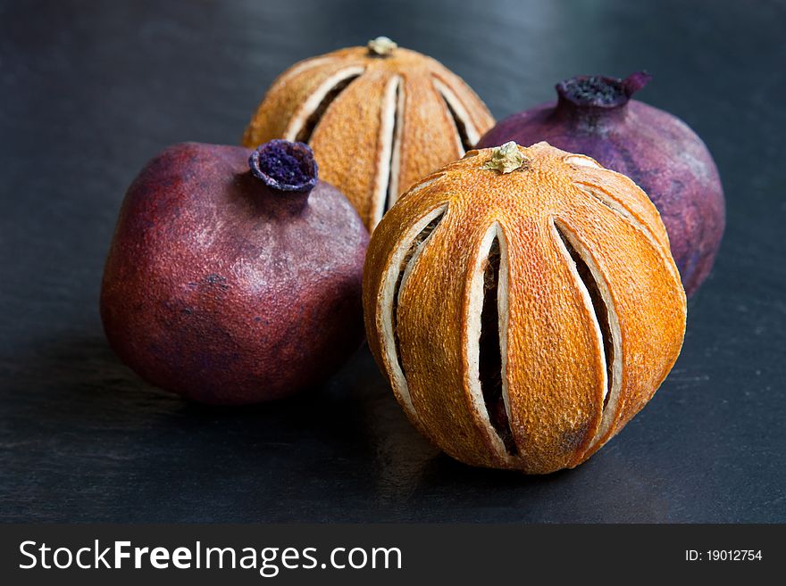 Pomegranates & oranges, dried & spraypainted for use as pot pourri. Pomegranates & oranges, dried & spraypainted for use as pot pourri