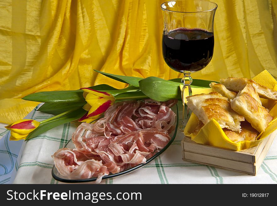 Typical Italian sausage sliced â€‹â€‹cake and flowers. Typical Italian sausage sliced â€‹â€‹cake and flowers
