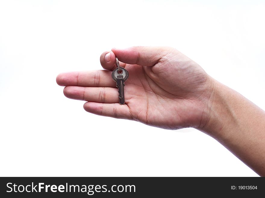 Silver Key In A Hand Isolated