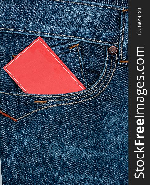 Red note paper in jeans front pocket