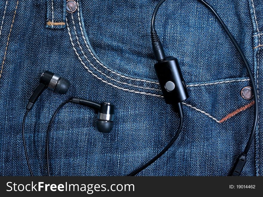 Headset in jeans front pocket. Headset in jeans front pocket