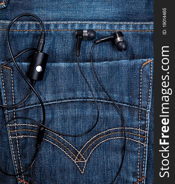 Earphones in back pocket blue jeans. Earphones in back pocket blue jeans