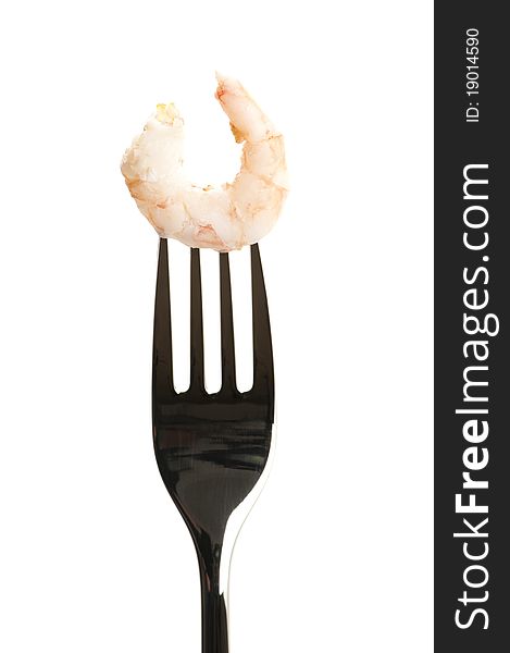 One shrimp on a fork ready to eat.