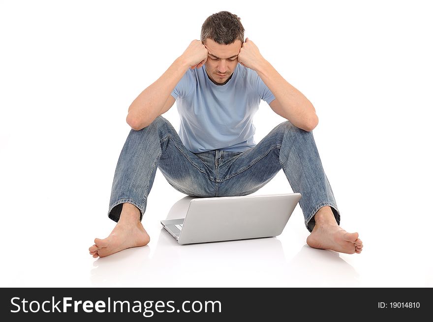 Handsome young male working on laptop computer. isolated. Handsome young male working on laptop computer. isolated