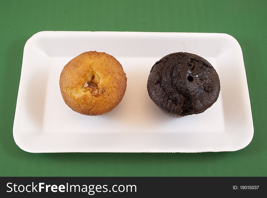 Chocolate and vanilla muffins on white tray