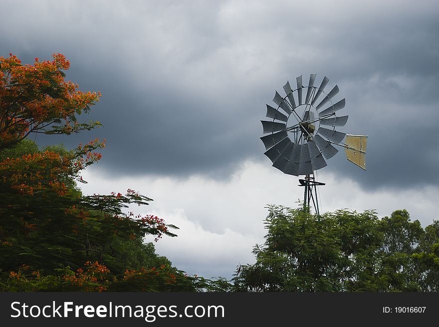 Windmill On A Cloudy Sky