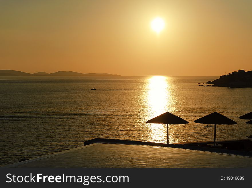 Sunset over port of Mykonos, Greece