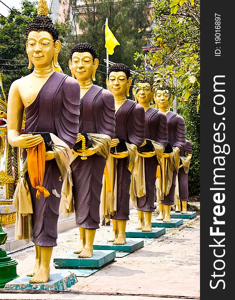 Row of monks receive food