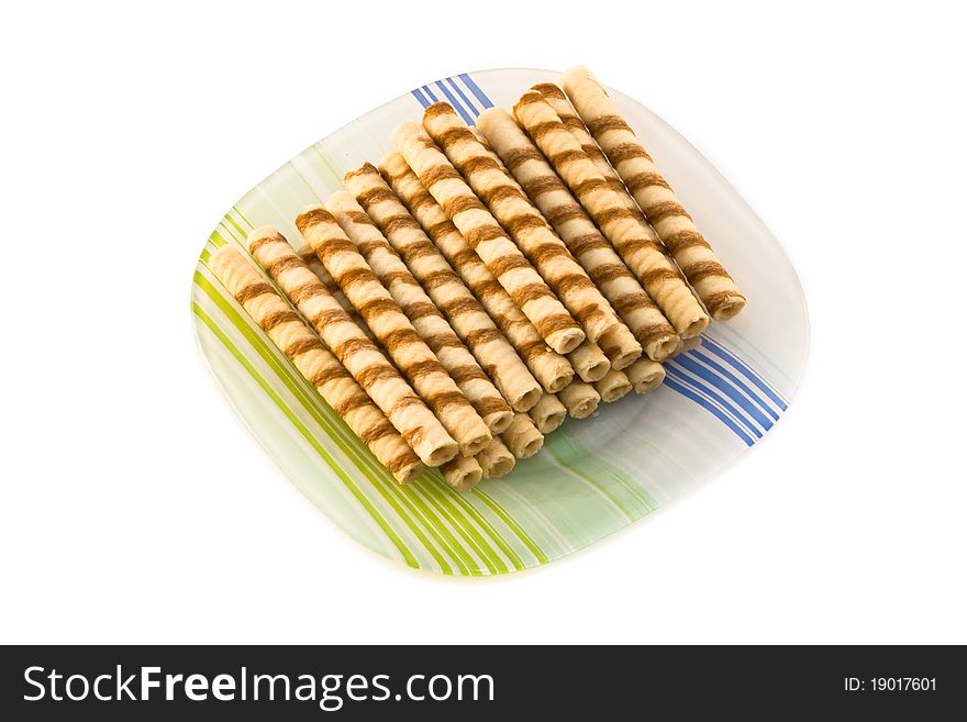 Plate of fresh baked cookies isolated on a white background.