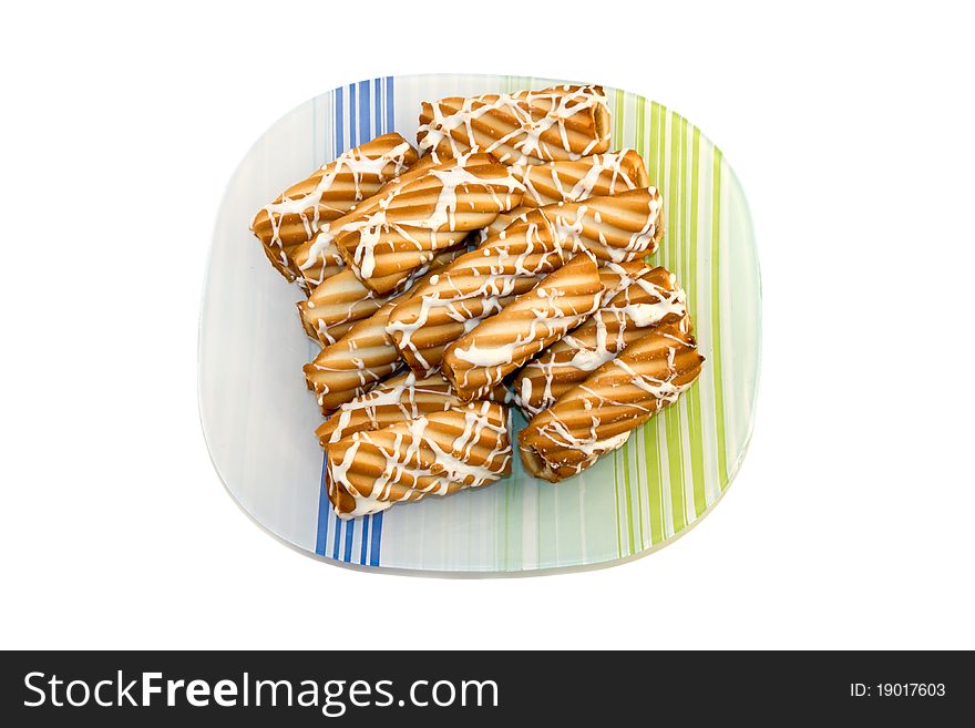 Plate of fresh baked cookies isolated on a white background.