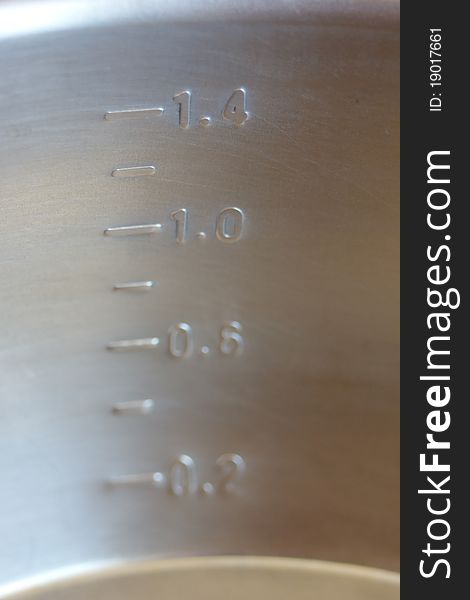 Metal measuring pot - close-up of the scale