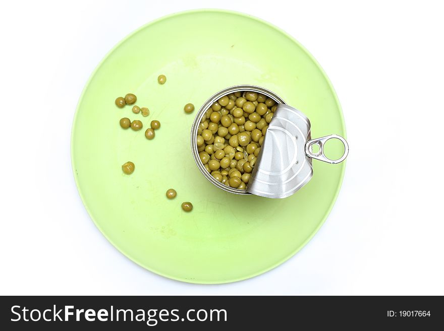 Green peas in a bowl with a fork and spoon