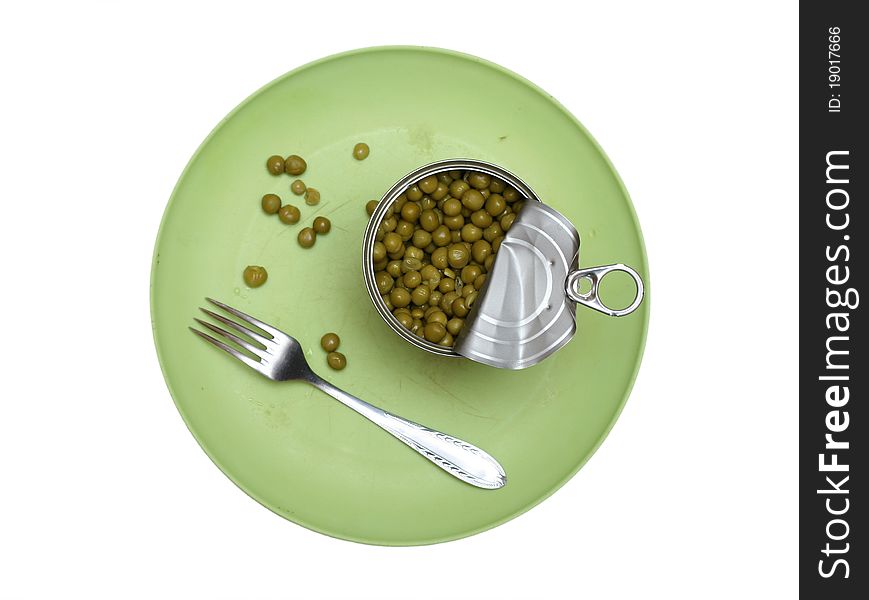 Green peas in a bowl with a fork and spoon