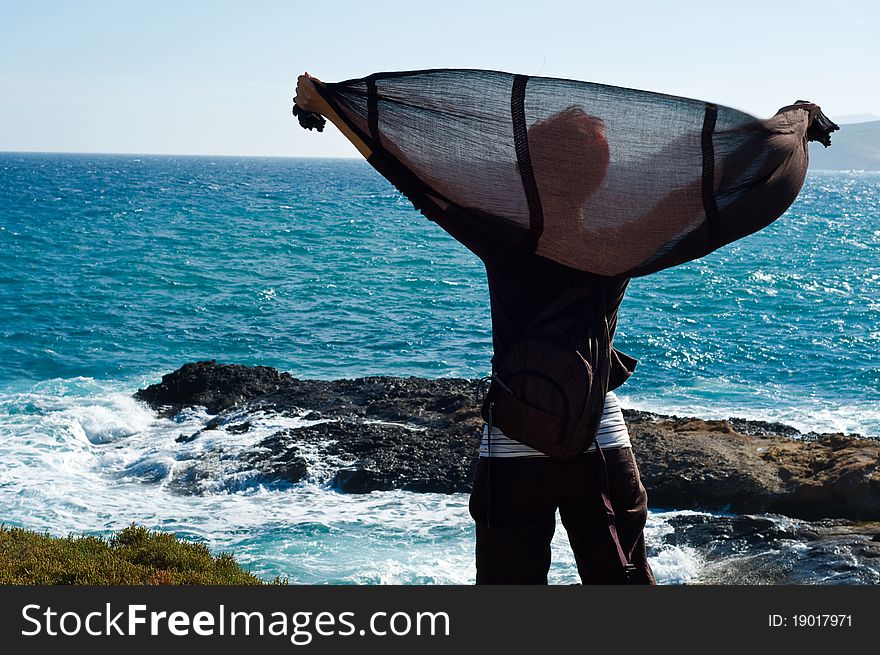Woman standing on a Coastline in Greece. Woman standing on a Coastline in Greece