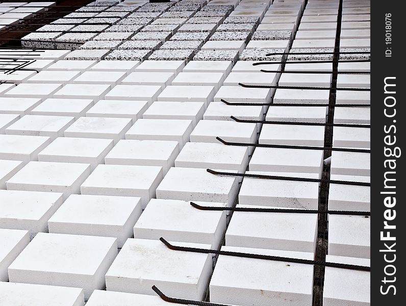 Technical detail of building operations: floor. Materials: polystyrene, steel bars, concrete. Technical detail of building operations: floor. Materials: polystyrene, steel bars, concrete