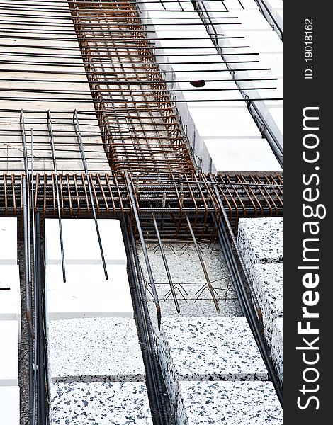 Technical detail of building operations: floor. Materials: polystyrene, steel bars, concrete. Technical detail of building operations: floor. Materials: polystyrene, steel bars, concrete