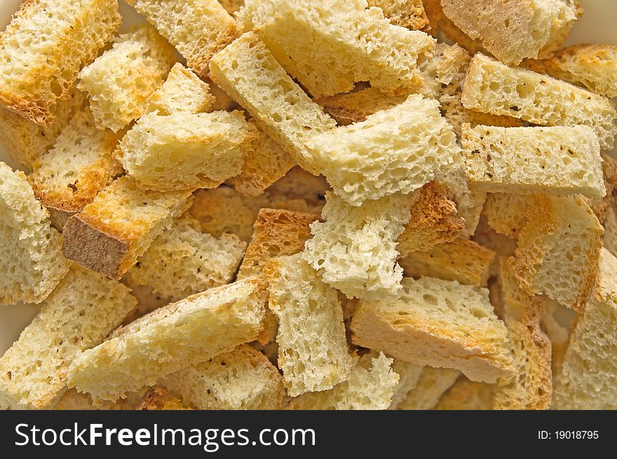 Crispy brown croutons close up shot for background. Crispy brown croutons close up shot for background