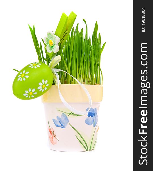 Hand painted Easter eggs and grass isolated on white background