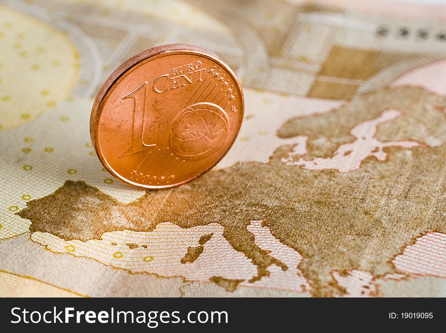 Close up shot of one euro cent on a banknote