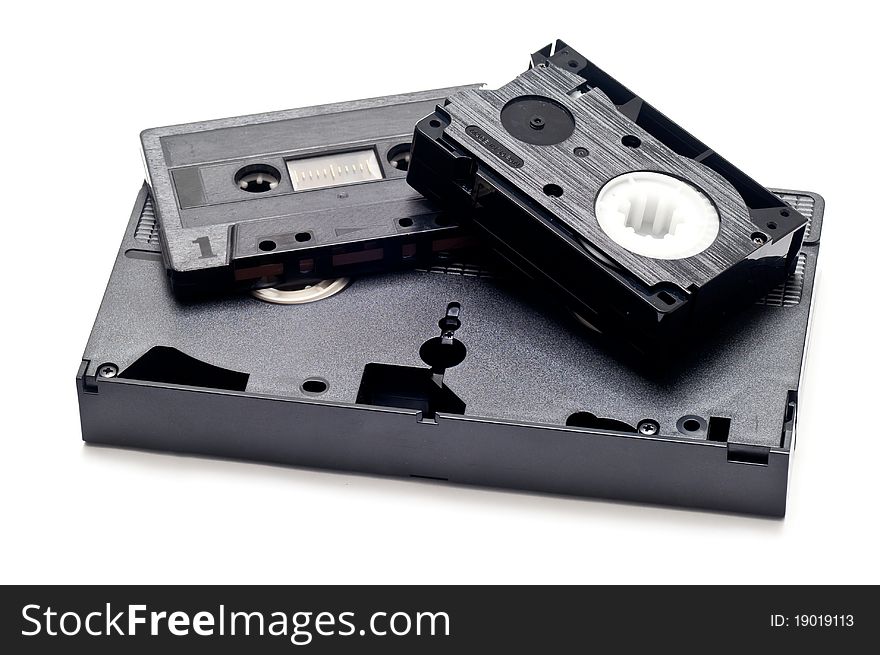 Old media storage carriers over a white background