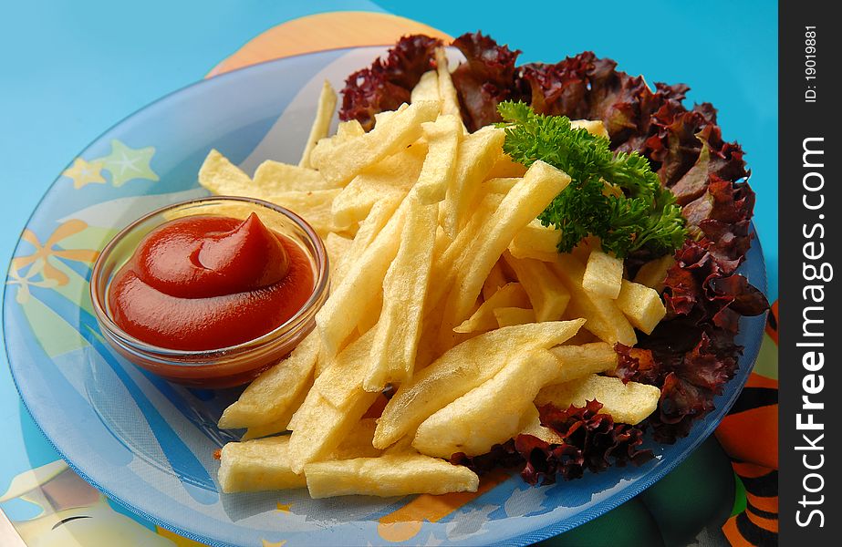 fried potatoes with gravy and vegetables on the plate