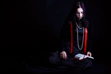 A Goth-girl Is Reading The Bible Stock Photography