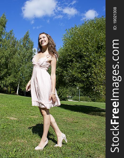 Beautiful young happy woman under blue sky. Beautiful young happy woman under blue sky.