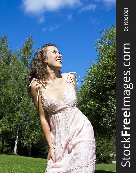 happy woman with beautiful face posing outdoors. happy woman with beautiful face posing outdoors