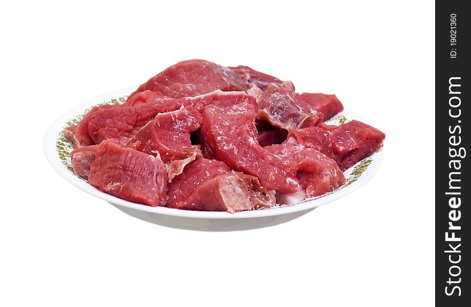 Chilled beef slices on a plate isolated on white background