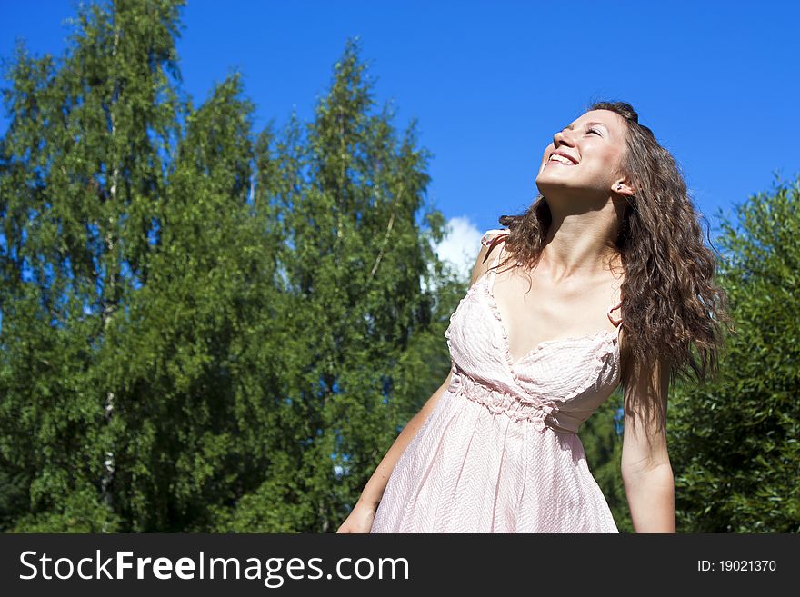 Portrait of the young beautiful smiling woman outdoors. Portrait of the young beautiful smiling woman outdoors