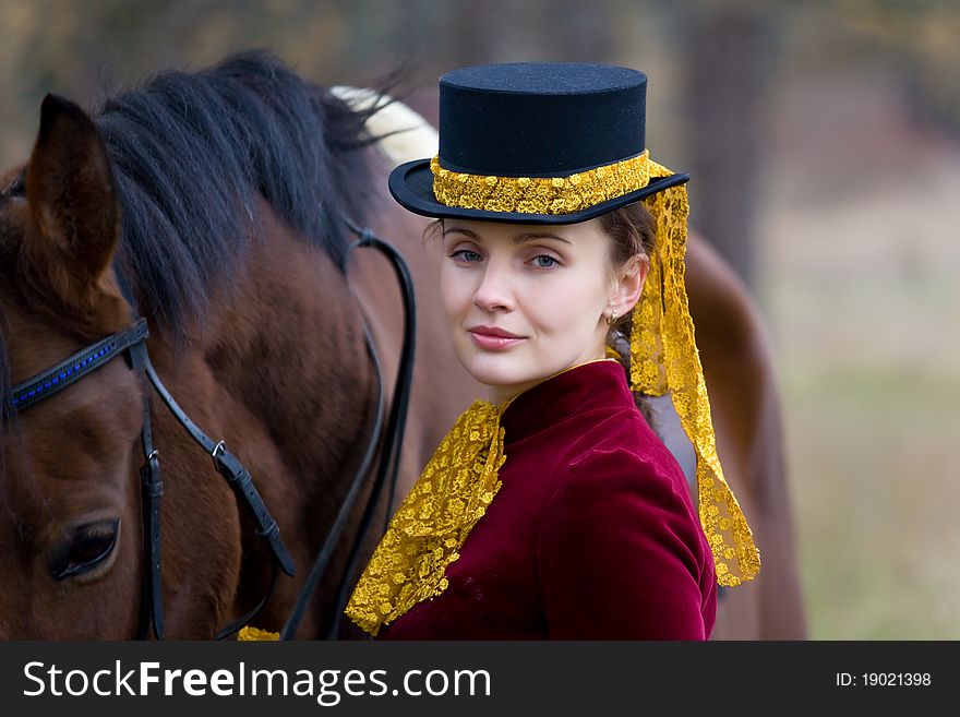 Horsewoman in vintage stylized suit.