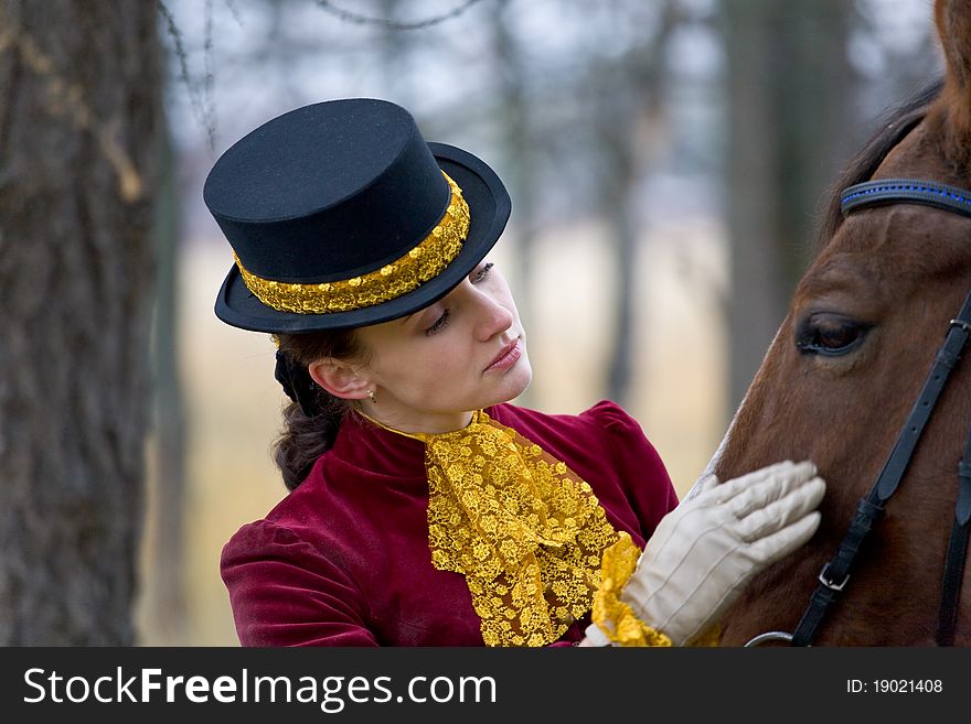 Horsewoman in vintage stylized suit.