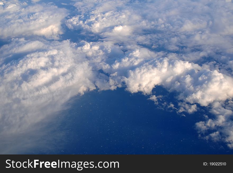 Photograph taken above the clouds over the Pacific Ocean.