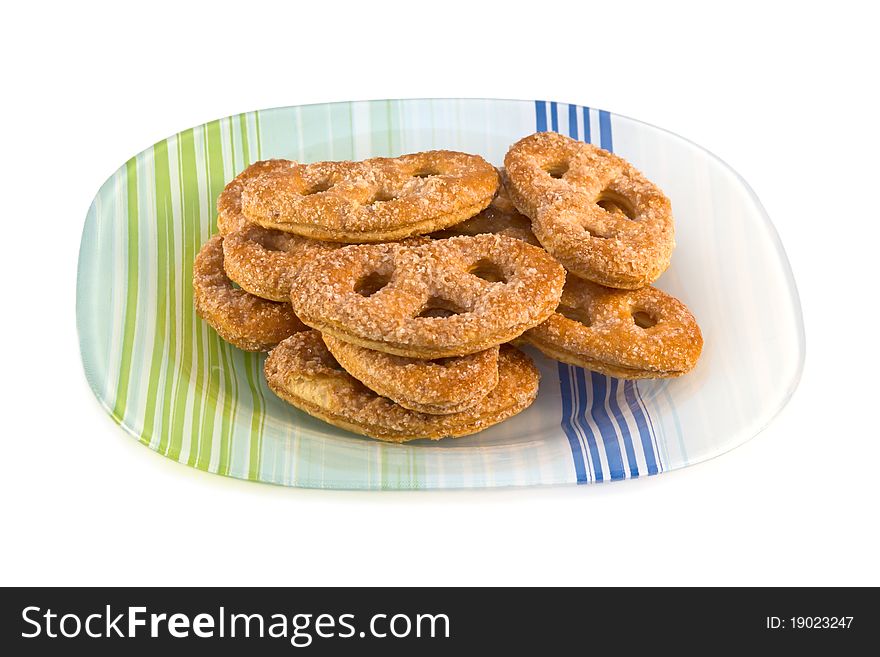 Plate of fresh baked cookies isolated on a white background.