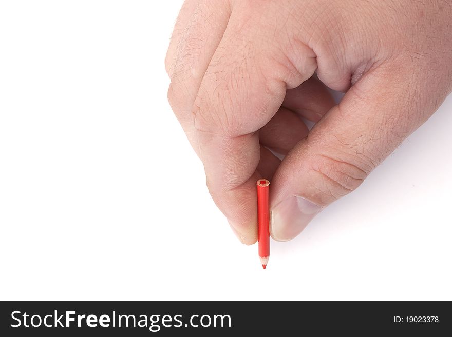 Mans hand holding a tiny red pencil on a white background. Mans hand holding a tiny red pencil on a white background