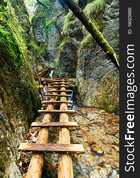 Mountain stream with ladder in canyon. Mountain stream with ladder in canyon